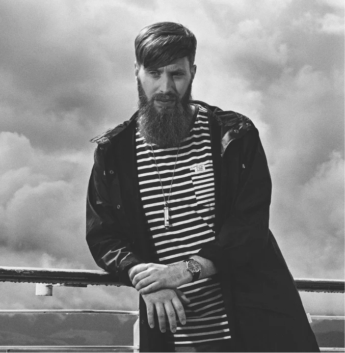 Stylish man with long well-groomed beard outdoors – TheBarber.ch professional beard care scrub and oil service Zurich